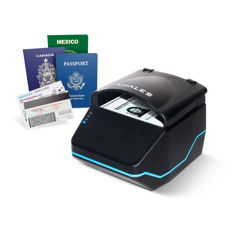 Thales QS2000 document reader shown with passports and a driver license it can scan